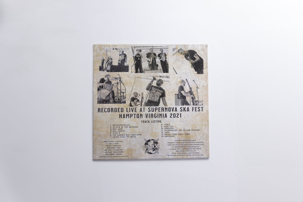 A square printed cover or poster mounted against a plain light gray wall. The artwork has a distressed beige background with multiple small black-and-white photos arranged in a collage, plus black text reading 'RECORDED LIVE AT SUPERNOVA SKA FEST HAMPTON VIRGINIA 2021' and additional track/artist text below.